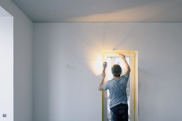 Person insulating a window-1